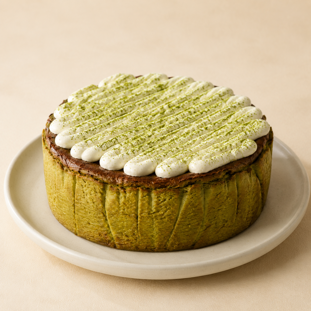 A whole Matcha Basque cooling in its parchment collar